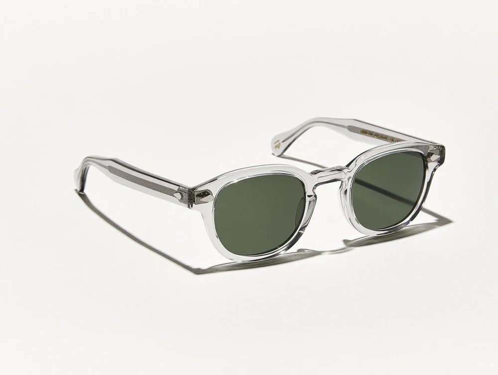 Lunettes Moscot Lemtosh Light Grey taille 46 Average avec monture en gris translucide et verres verts.